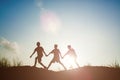 Silhouette of children playing in the park sunset time