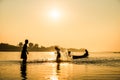 Silhouette of children playing water with friend