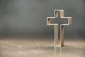 Silhouette of christian cross on grey background, soft bokeh lights background. Copy space. Church worship, salvation Royalty Free Stock Photo