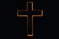 Silhouette of christian cross, lights, bokeh on black background. Copy space. Faith symbol. Church worship, salvation