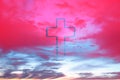 Silhouette of christian cross on pink background, soft bokeh lights background. Copy space. Church worship, salvation Royalty Free Stock Photo