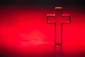 Silhouette of christian cross on red background, soft bokeh lights background. Copy space. Church worship, salvation Royalty Free Stock Photo