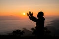 Silhouette of christian man hand praying,spirituality and religion,man praying to god Royalty Free Stock Photo