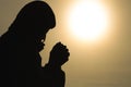 Silhouette of christian man hands praying to god, Man Pray for god blessing to wishing have a better life. begging for forgiveness Royalty Free Stock Photo