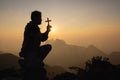 Silhouette of christian prayers raising hand while praying to the Jesus spirituality and religion,man praying to god. Christianity Royalty Free Stock Photo