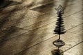 Silhouette of the christmas tree on a wooden floor