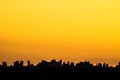 Silhouette of cityscaper buildings during a sunset Royalty Free Stock Photo