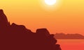 Silhouette of cliff and lake at sunset landscape Royalty Free Stock Photo