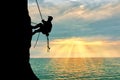 Silhouette climber climbing a mountain Royalty Free Stock Photo
