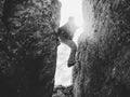 Silhouette of climber in crevasse in black and white