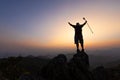 Silhouette of a Climber at the top of the rocky mountain at sunset, Man on top of mountain. Conceptual design. alone at the summit Royalty Free Stock Photo