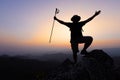 Silhouette of a Climber at the top of the rocky mountain at sunset, Man on top of mountain. Conceptual design. alone at the summit Royalty Free Stock Photo