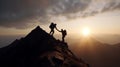 In silhouette of climbers reaching mountaintop, value of mutual support and trust is clear