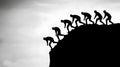 Silhouette of Climbing Figures Motivating Overcoming Challenges Royalty Free Stock Photo