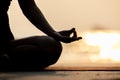 Silhouette Close up hand of woman practice yoga meditation lotus pose on the beach Royalty Free Stock Photo
