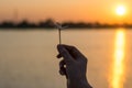 Silhouette close up woman hands holding flower in the park,Hope concept. Royalty Free Stock Photo