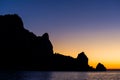 Silhouette of coastal rocks at dawn Royalty Free Stock Photo