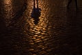 Silhouette on Cobblestone Path in Warsaw, Poland at Night Royalty Free Stock Photo