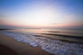 Silhouette of coconut tree slope down to the beach on sunrise background, Chumporn province Royalty Free Stock Photo