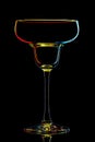 Silhouette of colorful margarita glass on black