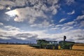 Silhouette of a combine harvester on the field