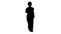 Silhouette Confident experienced forewoman walking with will to work.