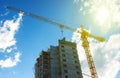 Silhouette construction crane equipment,Industrial construction crane and building over amazing sunset sky abstract Royalty Free Stock Photo