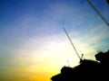 Silhouette Construction cranes machine against sky background. Royalty Free Stock Photo