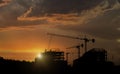 Silhouette Construction Site and Abandon building with sunset background