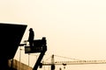 Silhouette of construction worker on scaffolding in the construction site before to night time Royalty Free Stock Photo