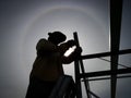 Silhouette of a construction worker working under hot sun Royalty Free Stock Photo