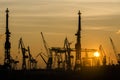 Silhouette of container harbor in Hamburg at sunset Royalty Free Stock Photo
