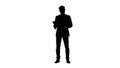 Silhouette Cool businessman using electronic tablet Royalty Free Stock Photo