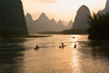 Cormorant fishermen on bamboo rafts in river, China Royalty Free Stock Photo