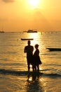 Silhouette couple on beach in sunset time,lover is celebrate in Valentine day by say love and propose.man and woman are getting Royalty Free Stock Photo