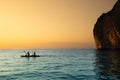 Silhouette of a couple on a boat in the sea at sunset, team work power, Phi Phi island in Krabi, Thailand Royalty Free Stock Photo