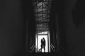Silhouette of a couple on bright background at the end of an underground pedestrian tunnel Royalty Free Stock Photo