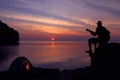 Silhouette couple camping and playing a guitar on the beach Royalty Free Stock Photo