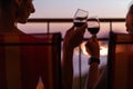 Silhouette of couple drinking wine at the sea view terrace in the evening. Valentine day image Royalty Free Stock Photo