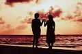 Silhouette of couple drinking wine at sunset beach Royalty Free Stock Photo