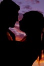 Silhouette couple heads close almost to kiss