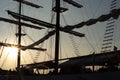 Silhouette of couple high mast on the big sailboat with clear sky of sunset in background Royalty Free Stock Photo