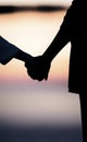 Silhouette of a couple holding hands Royalty Free Stock Photo