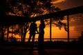 silhouette of couple holding hands at sunset Royalty Free Stock Photo