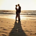 Silhouette, couple and kiss on beach at sunset for romantic, date and weekend getaway in Turkey. Woman, man or people in Royalty Free Stock Photo