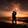 Silhouette of a couple kissing on the beach at sunset with fireworks shooting in the sky. New Year\'s fun and festiv Royalty Free Stock Photo