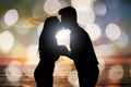 Silhouette of couple kissing at beach during sunset Royalty Free Stock Photo