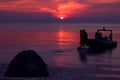 Silhouette couple kissing and camping on the beach. Royalty Free Stock Photo