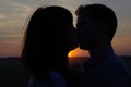 Silhouette couple kissing at sunset Royalty Free Stock Photo