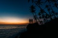 Silhouette of a couple in love on the beach. Man and woman at sunset. Honeymoon on the Islands. Man and woman meet sunset. Happy Royalty Free Stock Photo